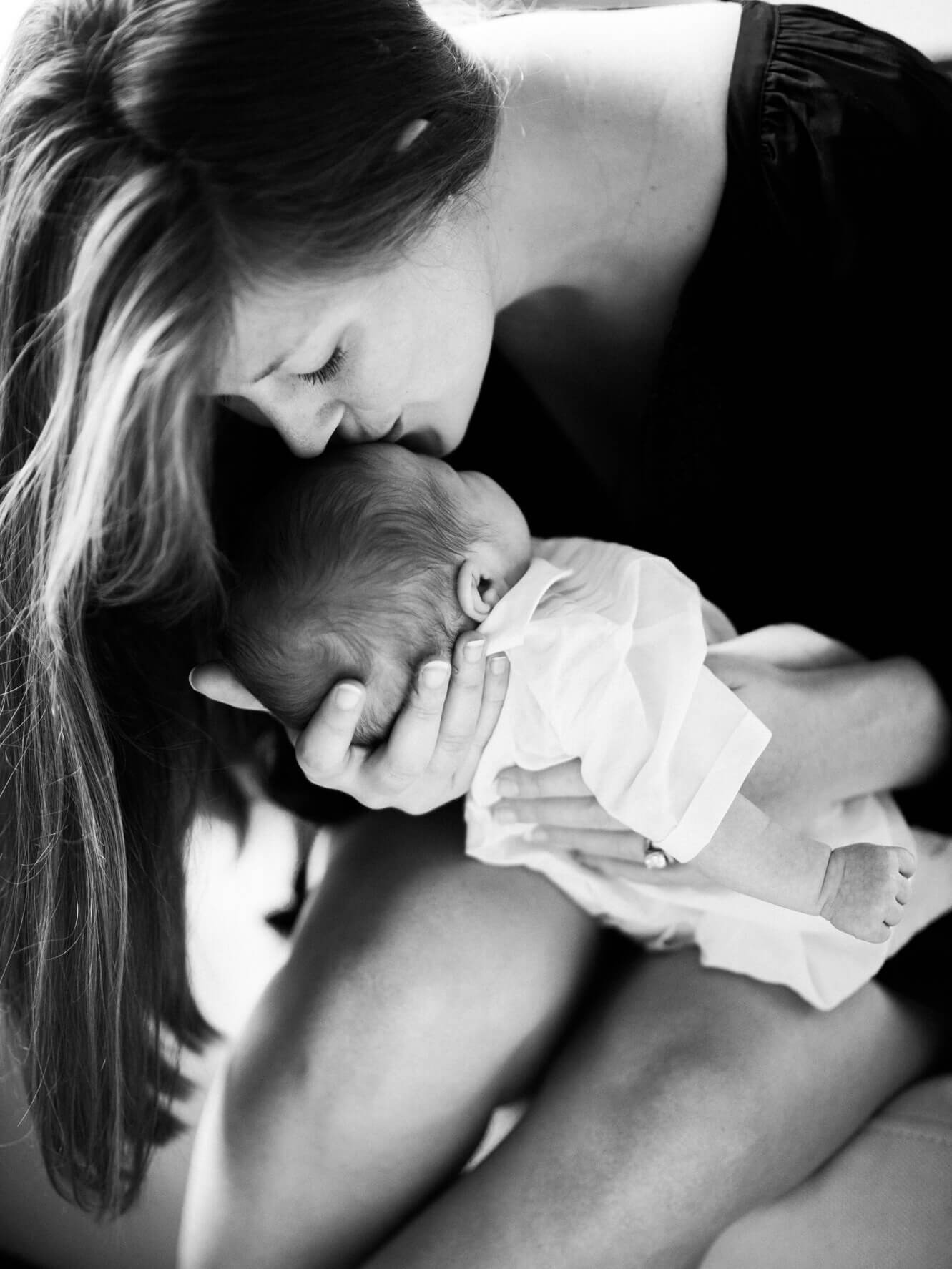 New mother kissing her baby - Nathan Abplanalp - Charlotte Newborn Photographer